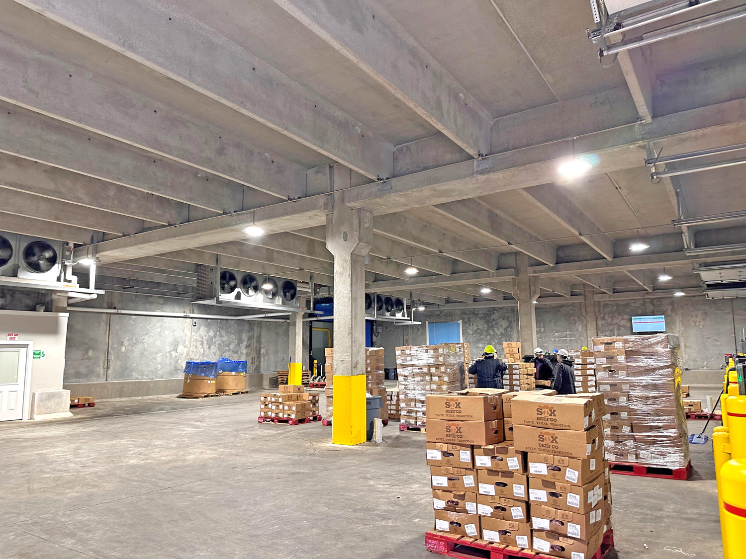 STX2 A large warehouse with boxes stacked on pallets.